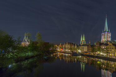 Germany, Luebeck, cityscape at night - NKF000243