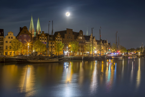 Germany, Luebeck, historic buildings at the Trave river at night stock photo