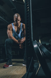 Portrait of young man having a rest in gym - MADF000315