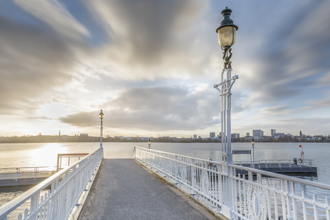 Germany, Hamburg, historic ferry pier at the Aussenalster at sunrise stock photo