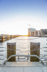 Germany, Hamburg, construction site of Elbe Philharmonic Hall by sunset - NKF000250