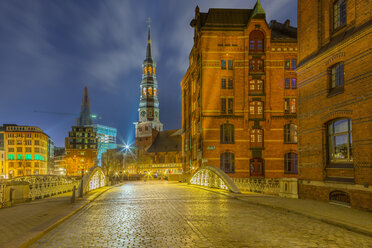 Germany, Hamburg, St. Catherine's Church in the old Warehouse District at night - NKF000258