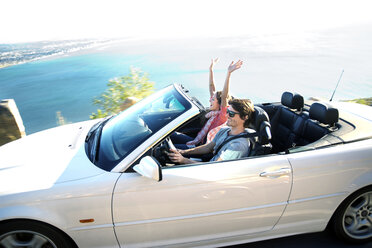 South Africa, happy couple in convertible on coastal road - TOYF000804