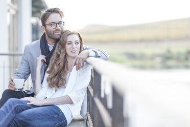 Happy couple relaxing on terrace of a restaurant - ZEF005104