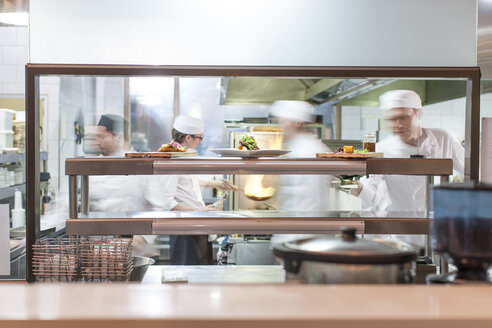 Chefs working in restaurant kitchen - ZEF005408