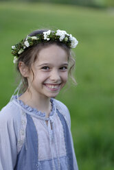 Germany, Portrait of a flower girl with flower wrath in hair - LBF001120