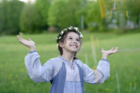 Germany, Portrait of a flower girl with flower wrath in hair - LBF001122