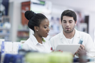 Pharmacists taking stock at drugstore - ZEF005891