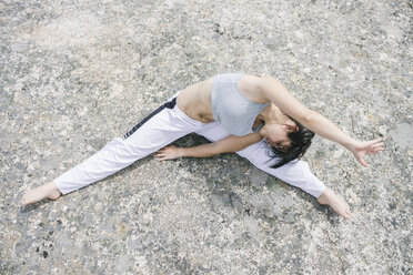 Woman exercising yoga outdoors - ABZF000053