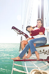 Happy young couple on a sailing ship - TOYF001043