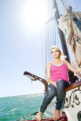 Blond young woman on a sailing ship - TOYF001045