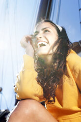 Happy young woman on a sailing ship - TOYF000909