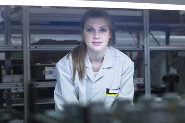 Portrait of young woman in storehouse - SGF001629