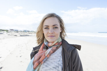 South Africa, Cape Town, portrait of smiling woman standing on the beach - ZEF005265