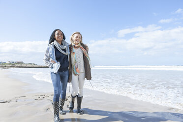 South Africa, Cape Town, two friends walking on the beach - ZEF005268