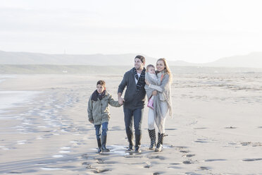South Africa, Cape Town, young couple with two children walking on the beach - ZEF005258