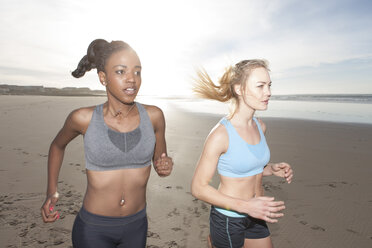 South Africa, Cape Town, two women jogging on the beach - ZEF005217