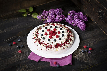 Raspberry-cream cake garnished with blueberries and raspberries - MAEF010596