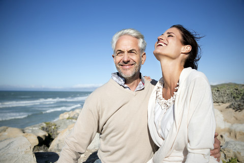 South Africa, happy couple on the beach stock photo