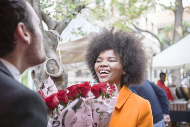 Man buying red roses for a woman - ZEF006587