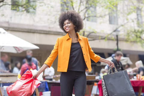 Portrait of young woman on shopping tour stock photo