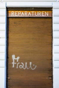 Closed shutter with graffiti woman, concept beauty craze - EJWF000760