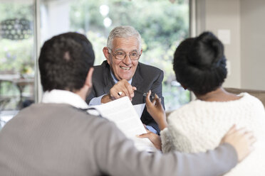 Young couple having a meeting with a salesman - ZEF005554