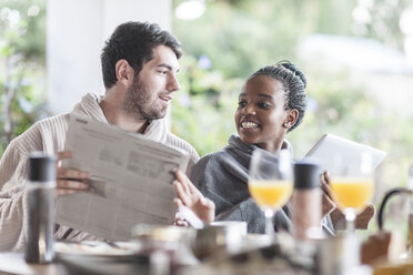 Young couple having breakfast on the terrace - ZEF005557