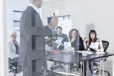 Business people having a meeting in board room - ZEF005593