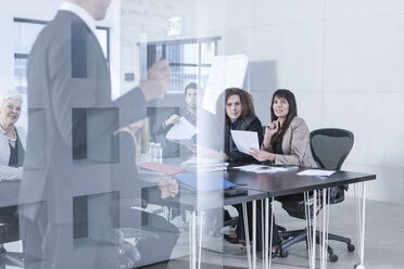 Business people having a meeting in board room - ZEF005594