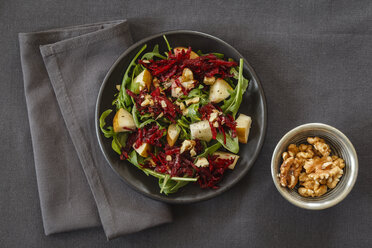 Bowl of beetroot salad with rocket and walnuts - EVGF001836