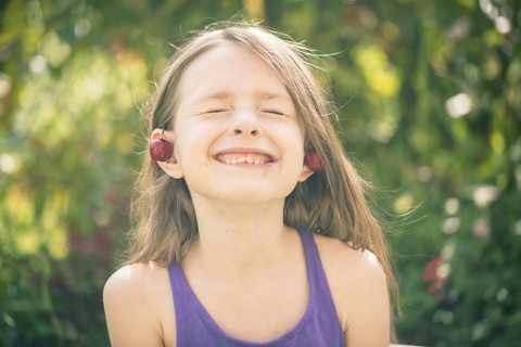 Portrait of girl decorated with cherries stock photo