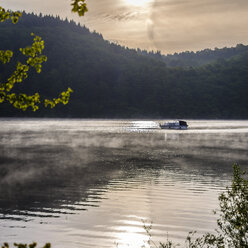 Germany, Hesse, Waldeck, Lake Edersee, boat and morning mist - MH000364