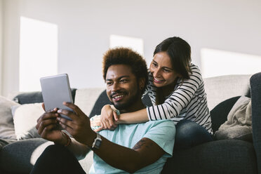 Young couple using digital tablet - EBSF000668