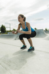 Young woman training in a skate park - UUF004633