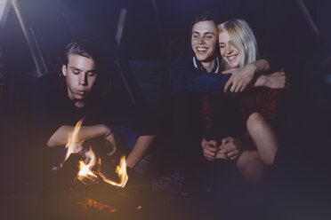 Friends sitting together at the campfire - GCF000104