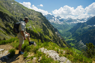 Germany, Bavaria, Allgaeu, Allgaeu Alps, hiker looking to Oy Valley - WGF000662