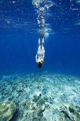 Maldives, woman snorkeling in the Indian Ocean - STKF001293