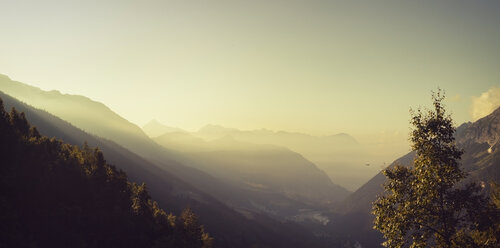 France, Lombardy, near Chiareggio, View to mountains, early-morning haze at sunrise - DWIF000526