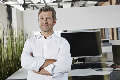 Portrait of a confident businessman in office stock photo