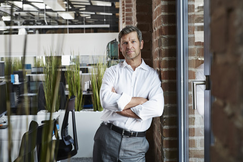 Portrait of a confident businessman in office stock photo