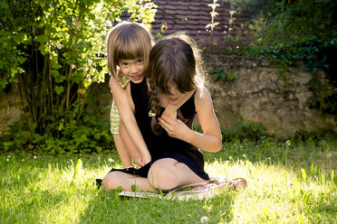 Two sisters together on a meadow - LVF003498