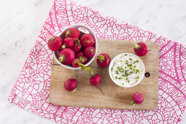 Bowl of red radishes and bowl of sour cream dip - SBDF002046