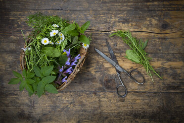 Wickerbasket of different wild herbs and edible flowers - LVF003506