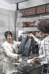 Woman shopping in luxury boutique - ZEF007001