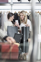 Two women shopping for clothes - ZEF006684