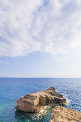 Greece, Aegean Islands, Rhodes, young man looking to rocky island - WDF003135