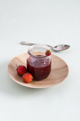 Strawberry jam in jar on plate - MYF001032