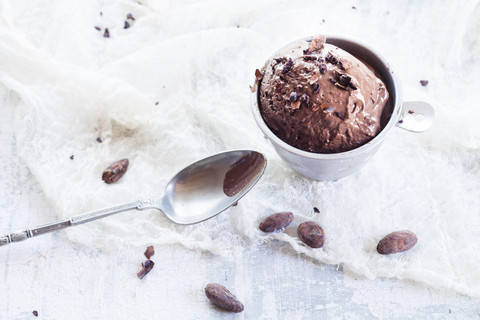 Cups of homemade chocolate icecream sprinkled with cacao nibs stock photo