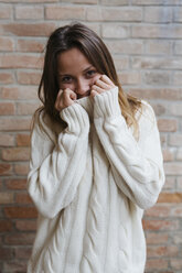 Portrait of young woman wearing turtleneck - GIOF000033